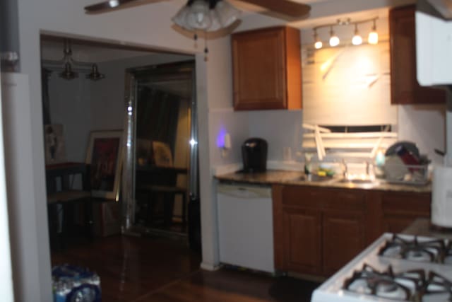 kitchen featuring ceiling fan, dark hardwood / wood-style flooring, and white appliances