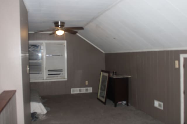 bonus room with ceiling fan and lofted ceiling