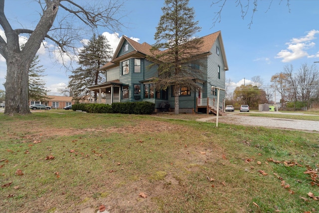 exterior space with a lawn and covered porch