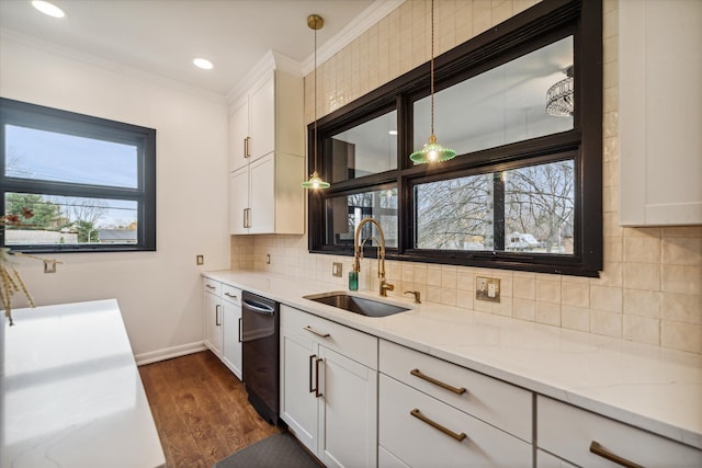 kitchen featuring decorative light fixtures, dark hardwood / wood-style floors, sink, and a wealth of natural light