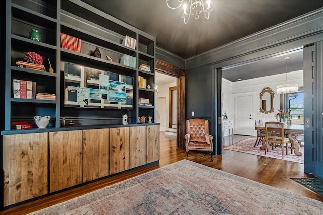 office area featuring hardwood / wood-style flooring, a notable chandelier, and crown molding