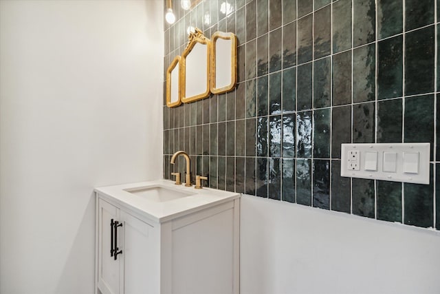 bathroom with vanity and tile walls