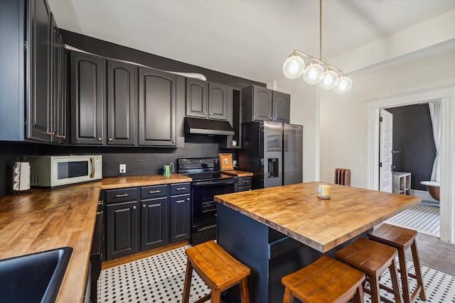 kitchen with butcher block counters, a kitchen breakfast bar, black range with electric stovetop, sink, and stainless steel fridge with ice dispenser