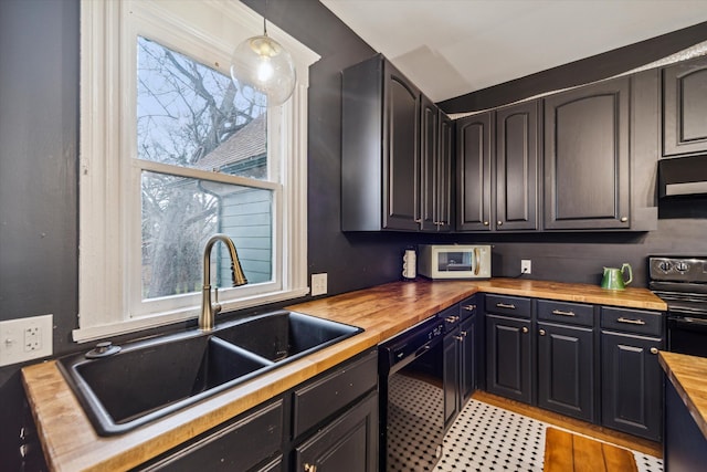 kitchen featuring pendant lighting, wood counters, black appliances, sink, and range hood