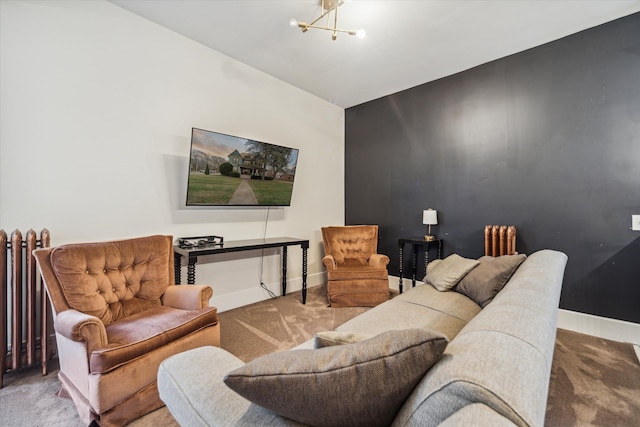 carpeted living room with an inviting chandelier