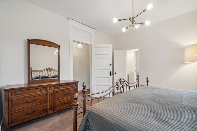 bedroom featuring carpet floors, an inviting chandelier, and vaulted ceiling