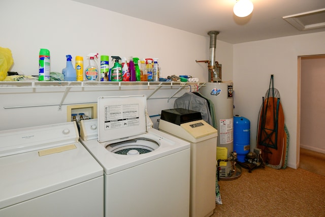 washroom with carpet floors, gas water heater, and washer and clothes dryer