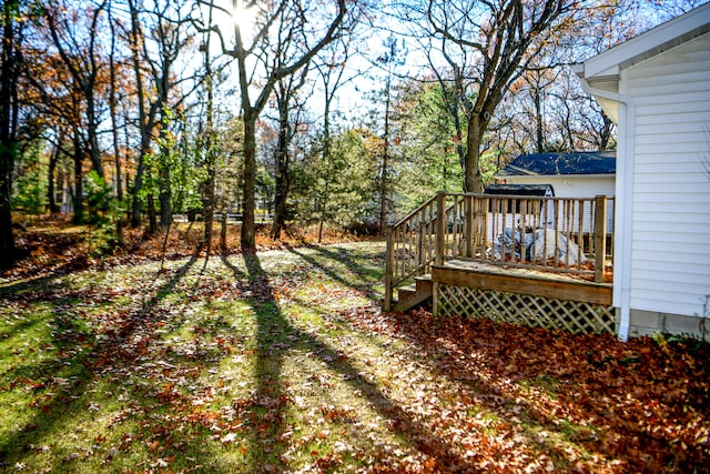 view of yard with a wooden deck