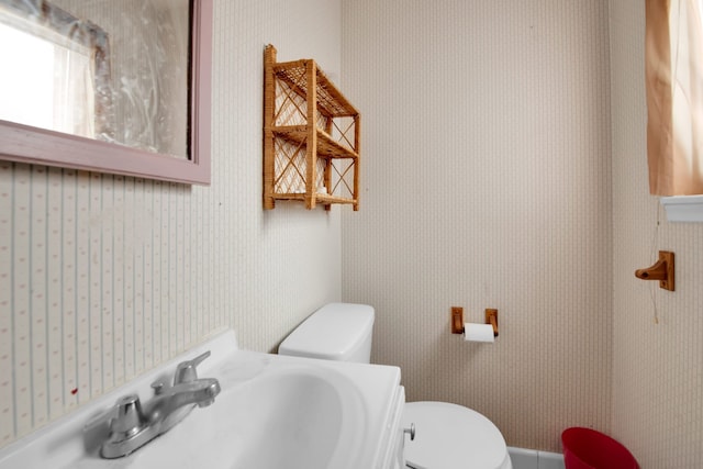 bathroom featuring sink and toilet