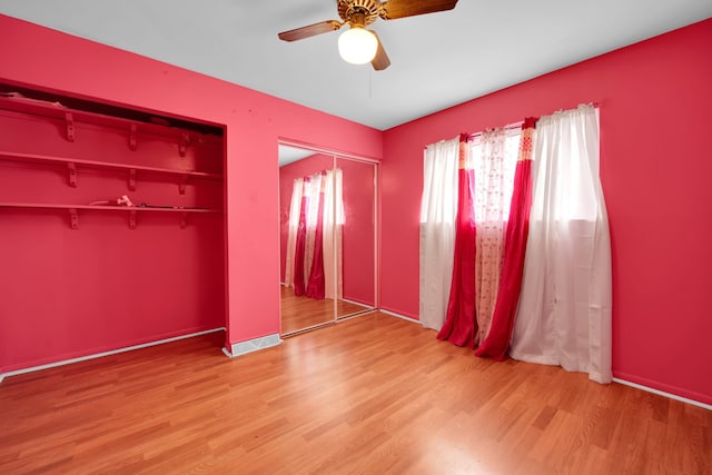 unfurnished bedroom featuring ceiling fan and wood-type flooring