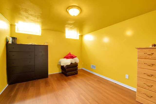 unfurnished room with hardwood / wood-style floors