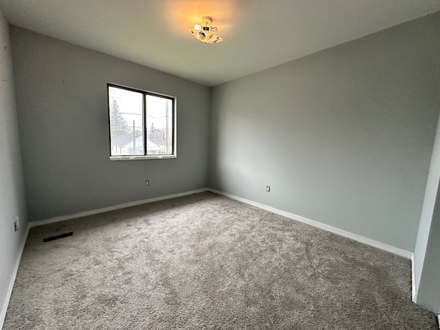 unfurnished room with carpet flooring