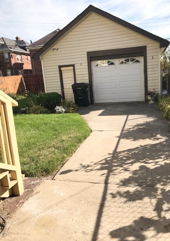 garage with a yard