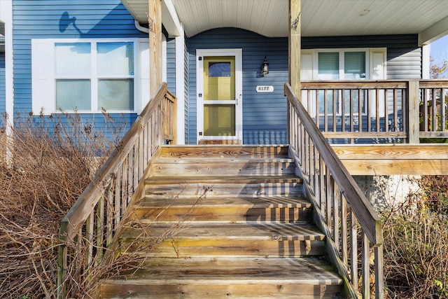 doorway to property featuring a porch