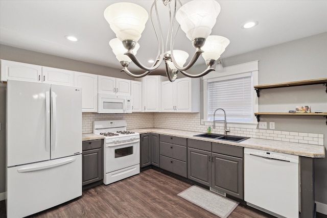 kitchen with white appliances, dark wood-type flooring, sink, white cabinets, and gray cabinets