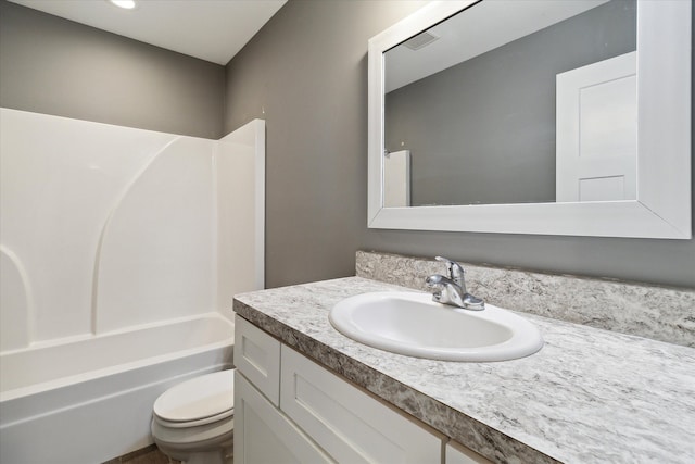 full bathroom with shower / bathing tub combination, vanity, and toilet