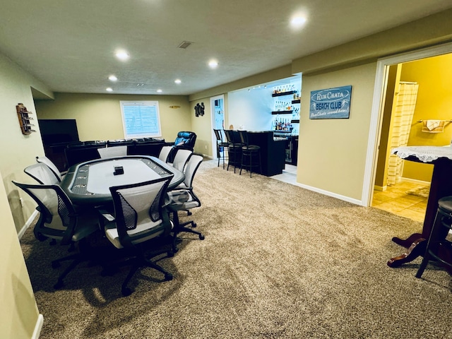 carpeted home office with bar area