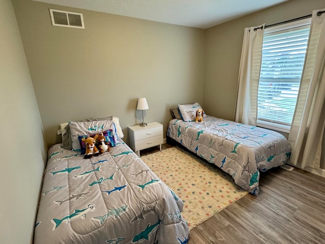 bedroom with light hardwood / wood-style floors