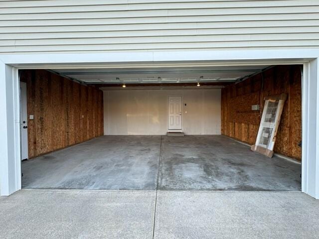 garage featuring wooden walls