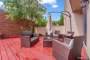 wooden terrace with outdoor lounge area