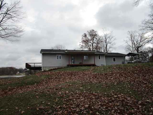 back of house with a wooden deck