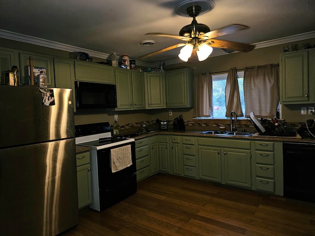 kitchen with black appliances, green cabinets, and sink