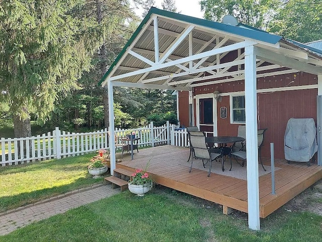 wooden deck with a yard