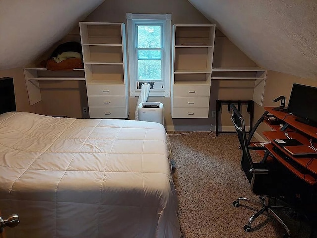 bedroom featuring lofted ceiling and carpet floors