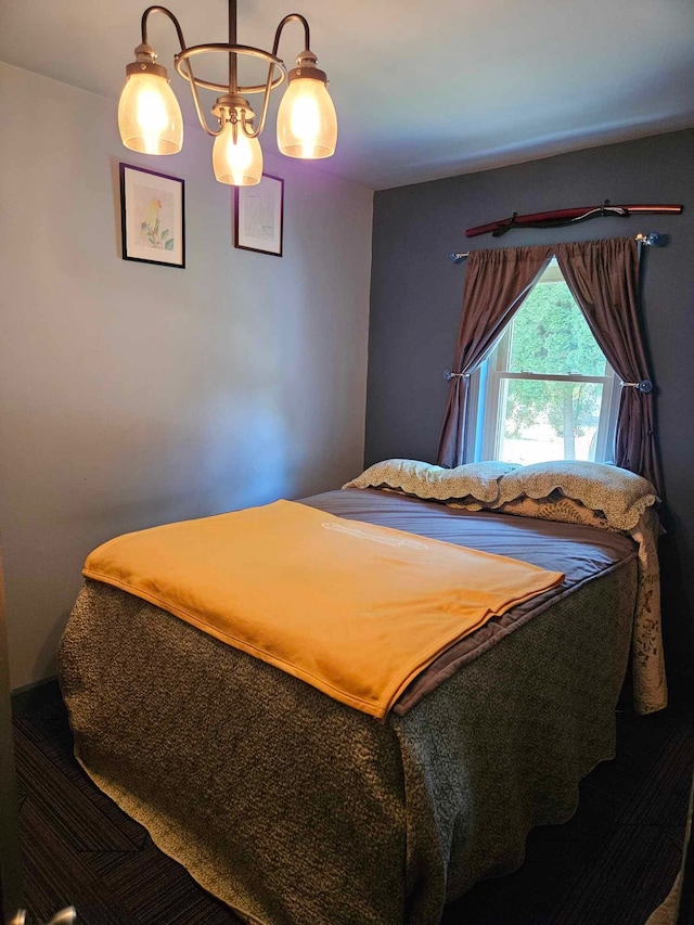 bedroom featuring a chandelier