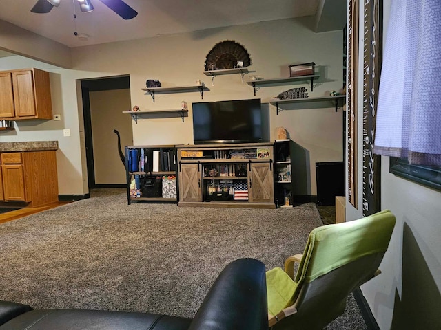 carpeted living room featuring ceiling fan