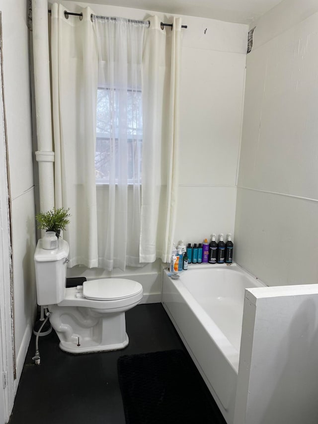 bathroom with a bathtub and toilet