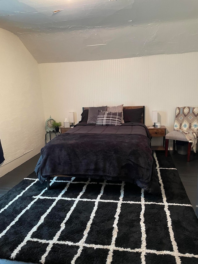 bedroom with lofted ceiling