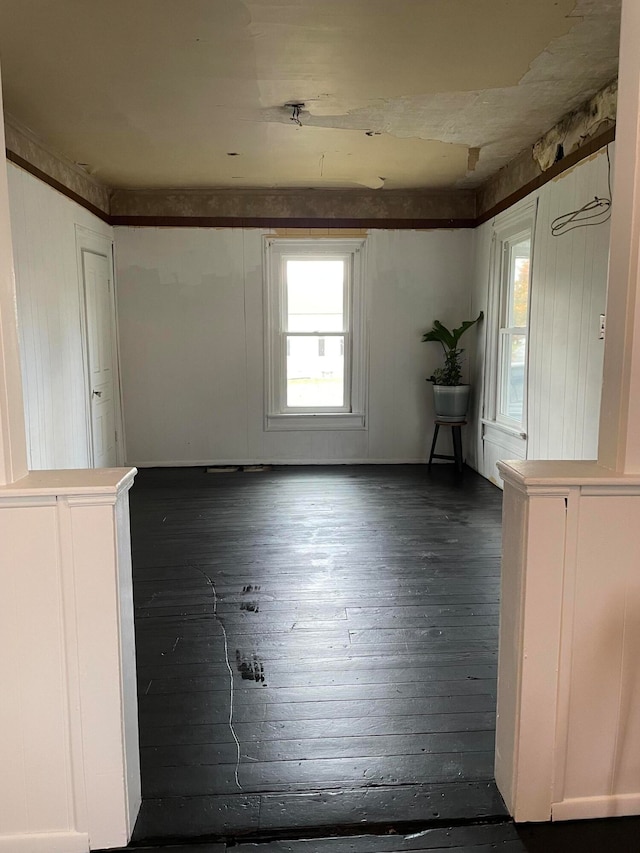 unfurnished room featuring dark hardwood / wood-style flooring