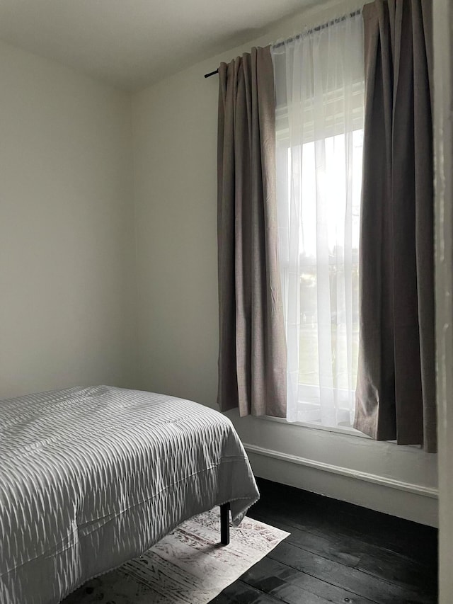 bedroom with wood-type flooring