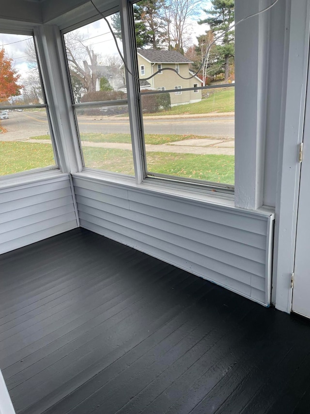 unfurnished sunroom with a healthy amount of sunlight