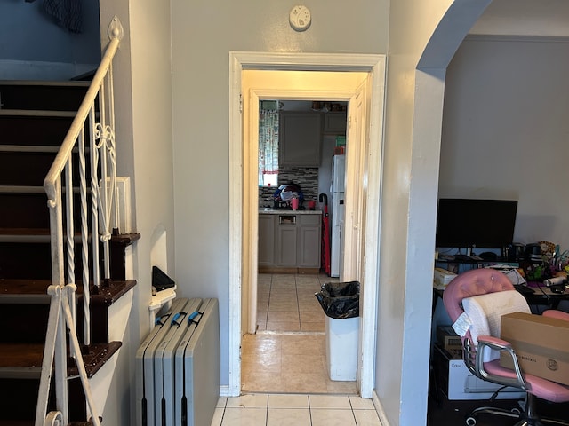 hall with light tile patterned flooring