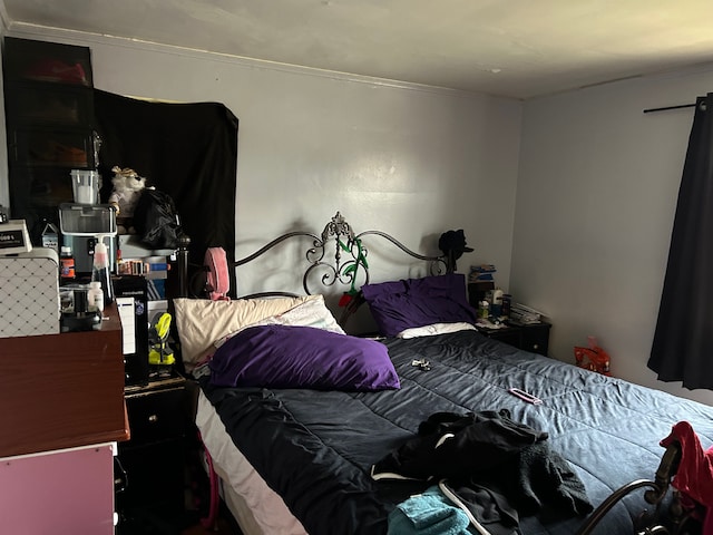 12644 Corbett St, Detroit, MI 48213 - bedroom featuring ornamental molding and a barn door