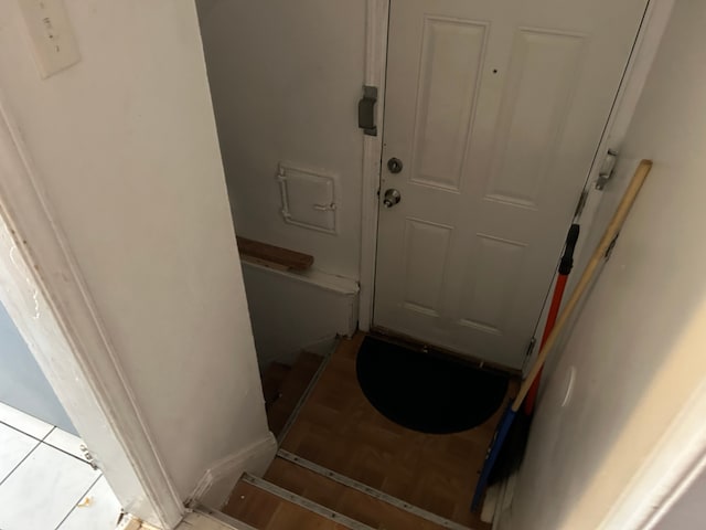 doorway to outside with light tile patterned floors