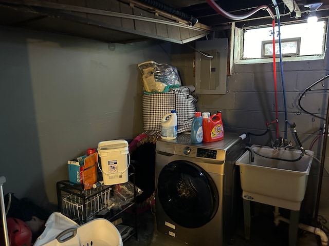 washroom with washer / dryer, sink, and electric panel