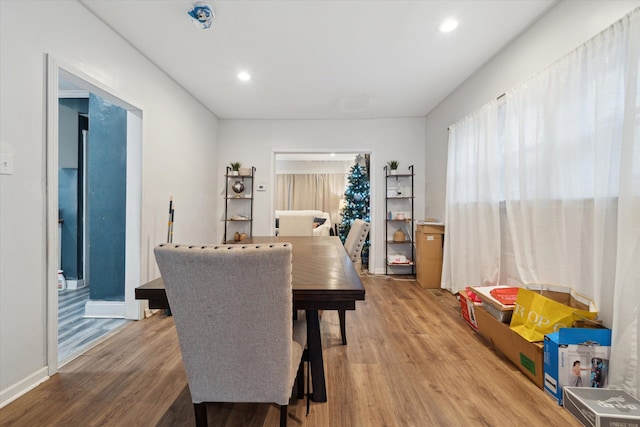 dining space with hardwood / wood-style flooring