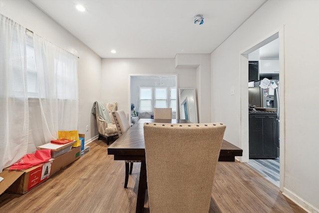 dining space featuring wood-type flooring