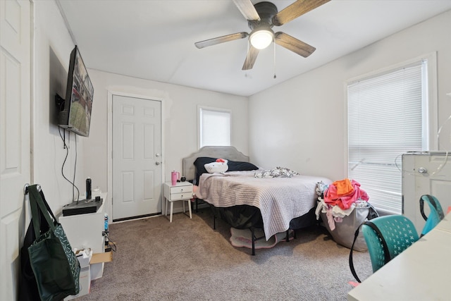 bedroom with light carpet and ceiling fan