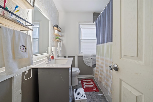 bathroom featuring vanity and toilet