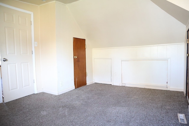 additional living space with lofted ceiling and carpet floors