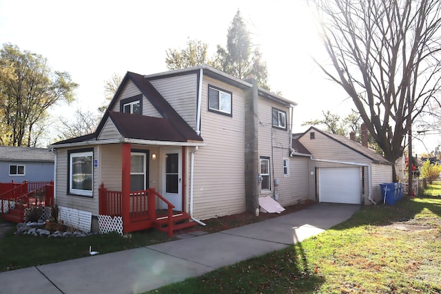 view of front of home with a garage and an outdoor structure