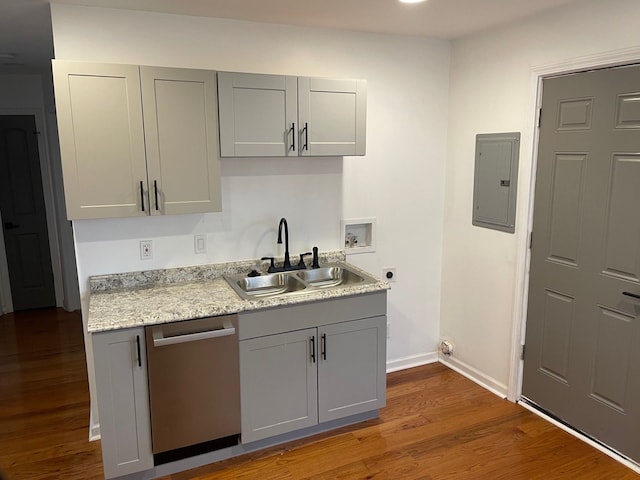 kitchen featuring gray cabinetry, dishwasher, sink, electric panel, and hardwood / wood-style floors