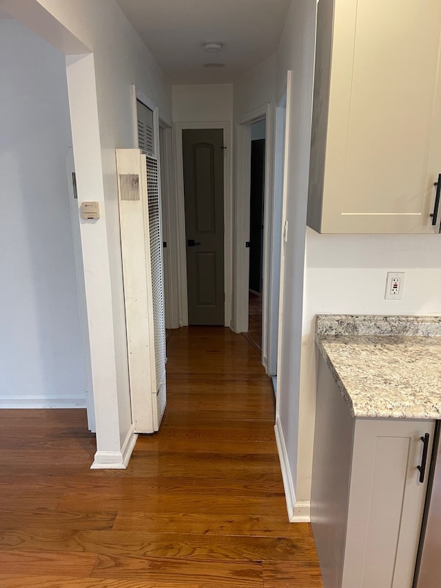 hall featuring dark wood-type flooring