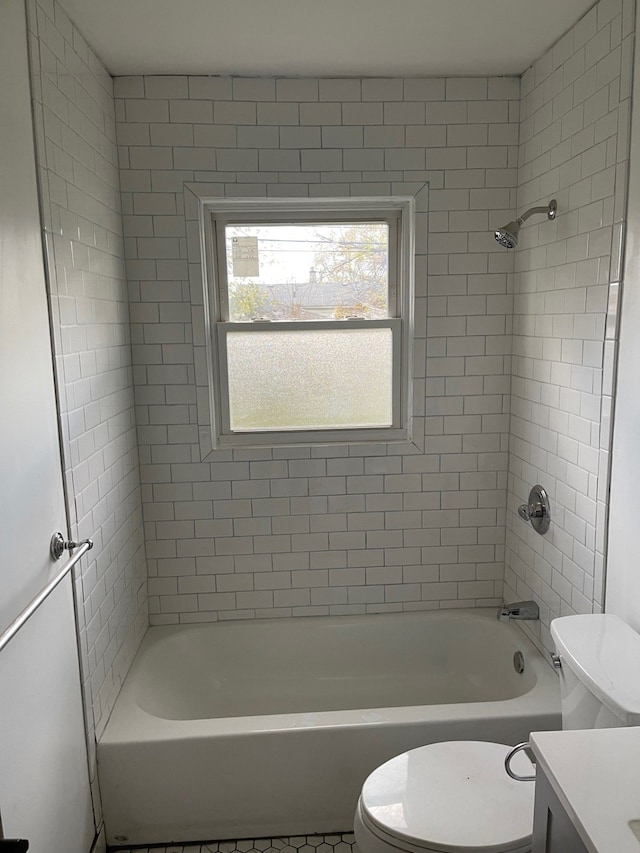 full bathroom with vanity, toilet, and tiled shower / bath