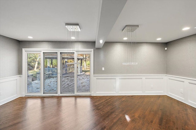 spare room featuring dark hardwood / wood-style floors