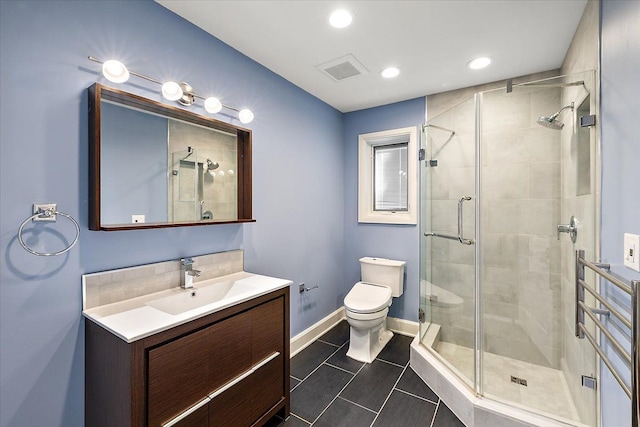 bathroom with tile patterned flooring, toilet, an enclosed shower, and vanity